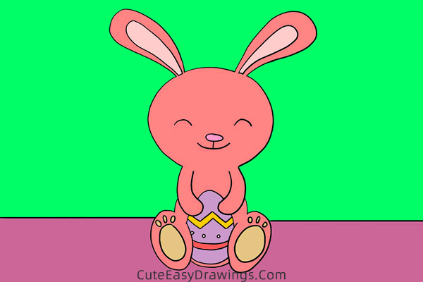 how to draw an easter bunny with an egg - www.cuteeasydrawings.com